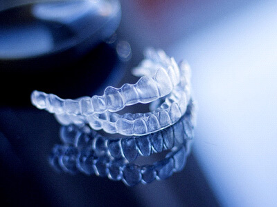 a pair of  clear aligners sitting on a table