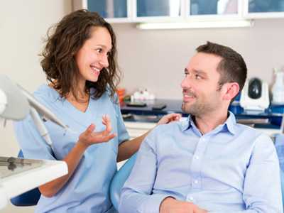 A man consulting his dentist about dental implants