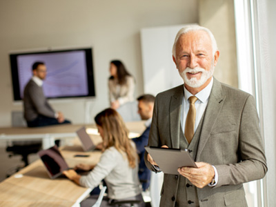 A happy and smiling senior businessman