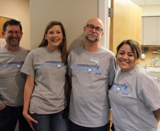 Four friendly dental team members