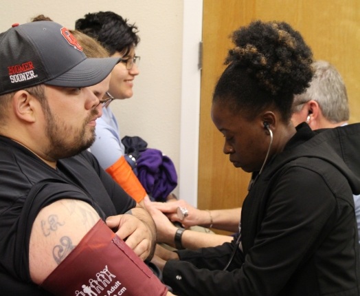 Dental team members examining dental patients