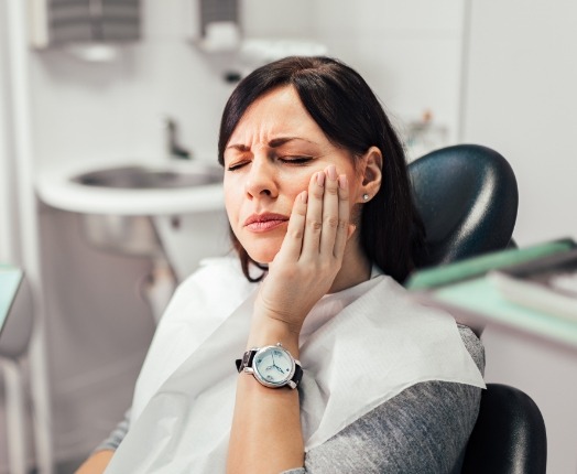 Woman in pain before emergency dentistry