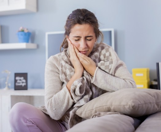 Woman in pain before tooth extraction