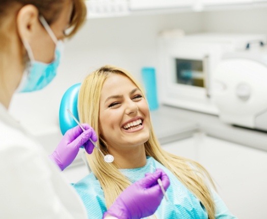 Woman laughing in dental treatment chair