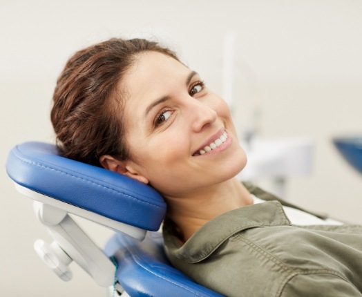 Woman at dental office smiling