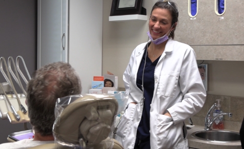 Dentist talking to dental patient