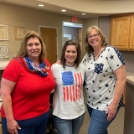 Three dental team members in the dental office