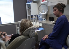 Dental team member talking to dental patient during comfortable dentistry visit