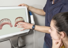 Dentist and dental patient using advanced dental technology