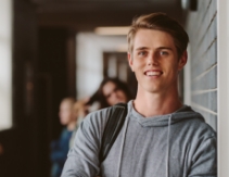 Young man with perfectly aligned smile after orthodontics