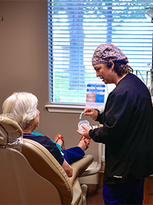 Dental team members discussing dental patient treatment plan