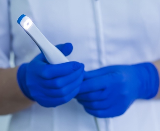 Dentist holding an intraoral camera