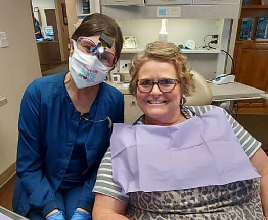 Doctor Grosskopf with dental patient in dentistry treatment room