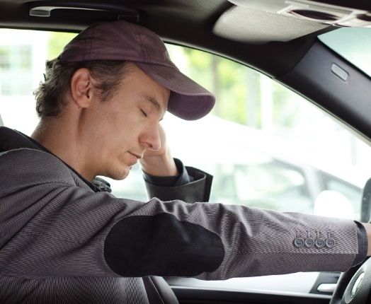 Tired dental patient falling asleep while driving