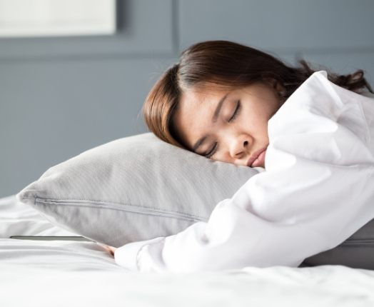 Woman sleeping soundly thanks to sleep apnea treatment