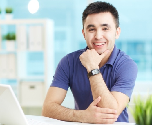 Man with traditional braces smiling