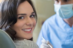 woman smiling in the dental chair