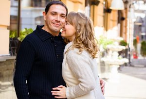 Happy middle age couple in love having fun outdoors and smiling. Romantic happy couple kissing and hugging. Sentimental happy couple in love bonding