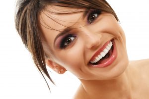 attractive young woman smiling showing bright white teeth