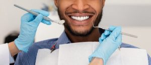 man receiving care from dentist in Temple