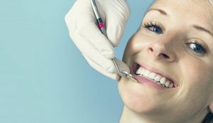 woman visiting dentist in Temple