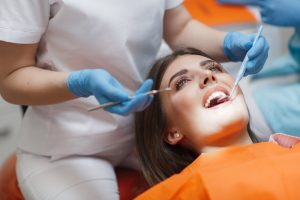 happy woman visiting dentist in Temple