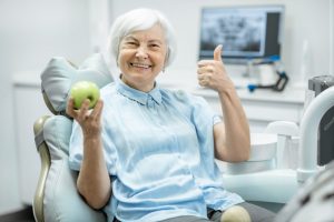 older woman visits dentist in Temple