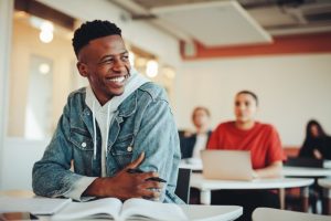 Student smiling in the classroom.