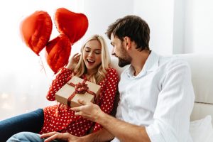 a person receiving a Valentine’s Day gift 