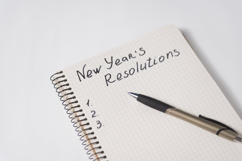 A closeup of a New Year’s resolutions notebook